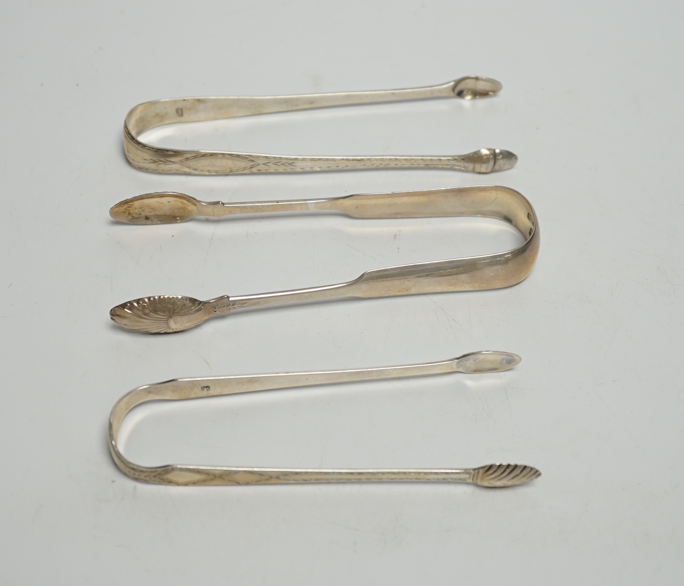 Nine assorted pairs of 19th century silver sugar tongs, including Scottish and Irish, various dates and makers